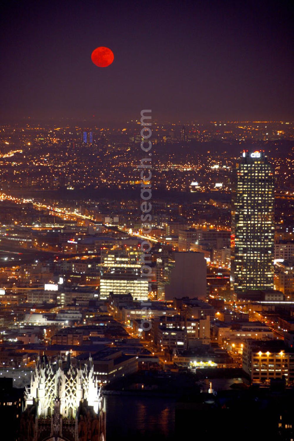 New York from above - Night Aerial view of the New York City borough of Queens on Long Island with the shining moon. At the Jackson Avenue is the skyscraper One Court Sqaure, which is also called Citigroup Building, because the bank was the client