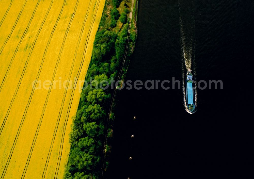 Dithmarschen from above - The North-East Sea Channel in Dithmarschen in the state of Schleswig-Holstein. The channel is the most used artificial water way in the world. It runs throught the landscape which is mostly informed by fields and is used by various ships