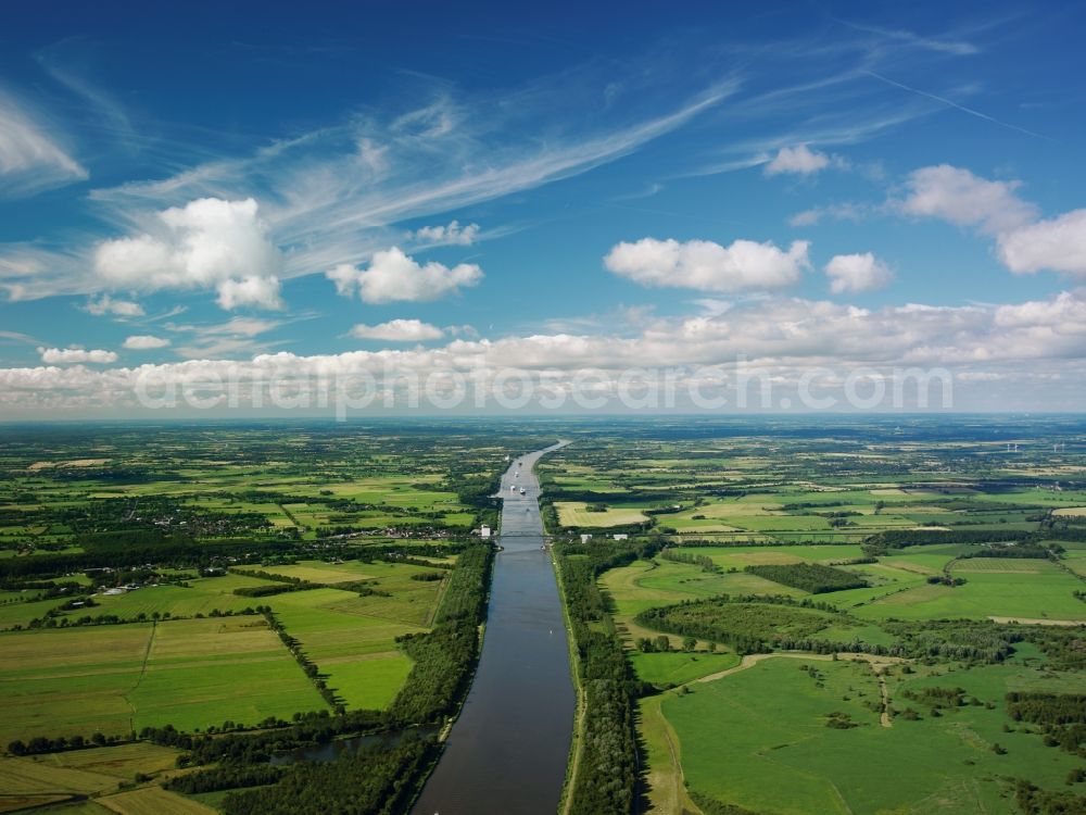 Aerial photograph Dithmarschen - The North-East Sea Channel in Dithmarschen in the state of Schleswig-Holstein. The channel is the most used artificial water way in the world. It runs throught the landscape which is mostly informed by fields and is used by various ships