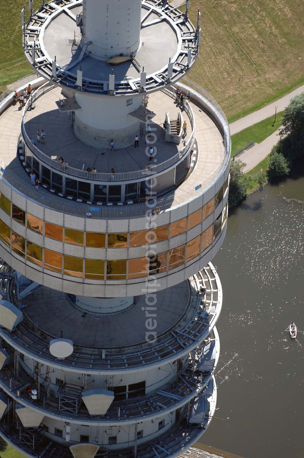 München from above - Der Olympiaturm ist ein Fernsehturm in München und eines der Wahrzeichen des Olympiaparks. Mit Antenne ist er 291,28 m hoch. Munich 2007/07/15 The Olympiatower is a television tower in Münich and one of the Olympiapark's landmark. Including the antenna, it is 291,28 meters high.