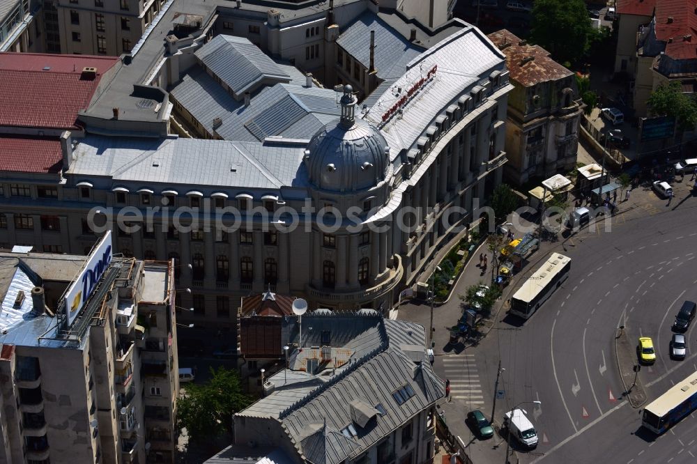 Bukarest from the bird's eye view: The palace of the commercial academy on the square Piata Romana in Sector 1 in the city center of Bucharest in Romania. The building with the dome is home of the Academy of Economic Studies. The square is a major traffic intersection in Bucharest