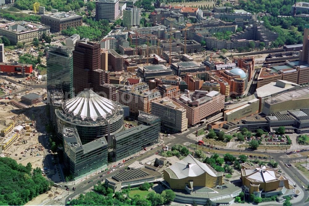 Aerial image Berlin - The new buildings with Kollhoff Tower, Bahn-Tower Sony Center at Potsdamer Platz is almost completed. The Parkkollonaden are incurred. In the foreground the Philharmonic and the Chamber Music Hall