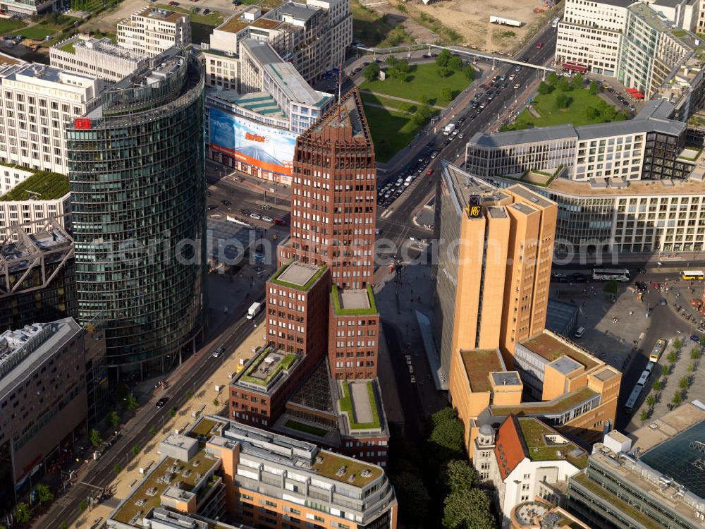 Aerial photograph Berlin - View of the Potsdamer Sqaure with the Kollhoff Tower, the Bahntower and the Quarter Daimler. The square was redesigned in 1991 by architect Richard Rogers as a so-called high-rise City for the 21st Century. potsdamerplatz.de