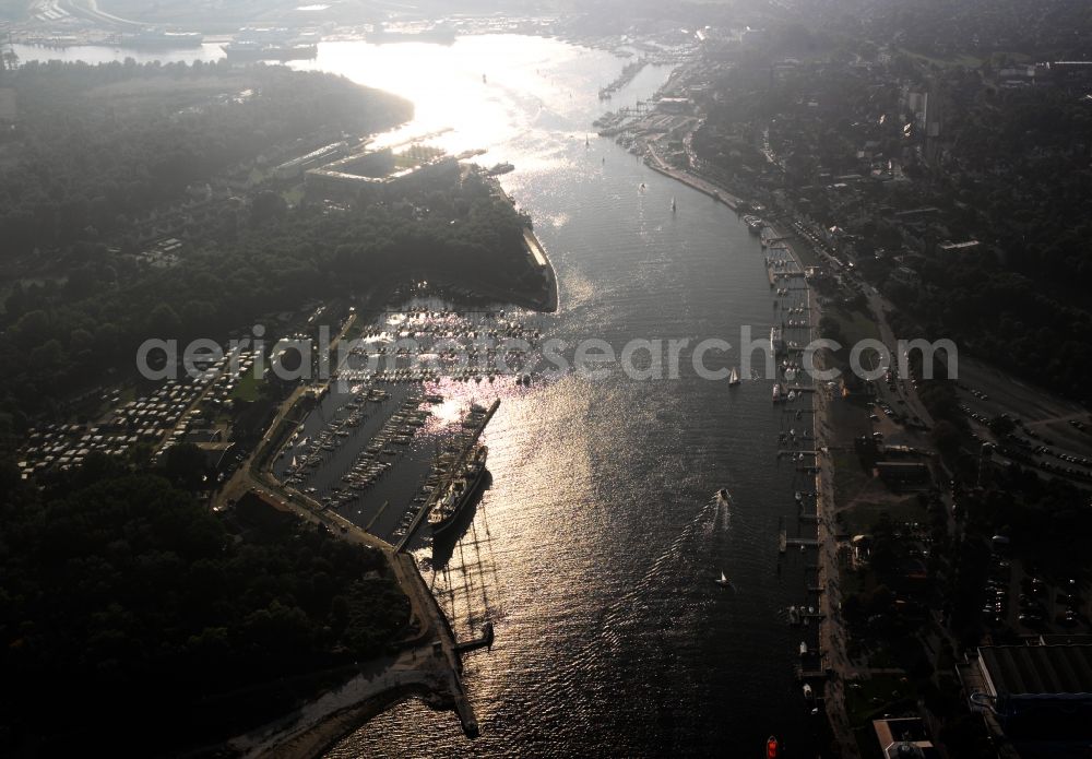 Lübeck from above - The Priwall harbour in the Travemünde part of Lübeck in the state of Schleswig-Holstein. The harbour is located at the river Trave on the mouth to the Baltic Sea. The harbour is on the Eastern riverbank on the peninsula of Priwall. It is primarily a yacht port, also used for sailing ships and ferries