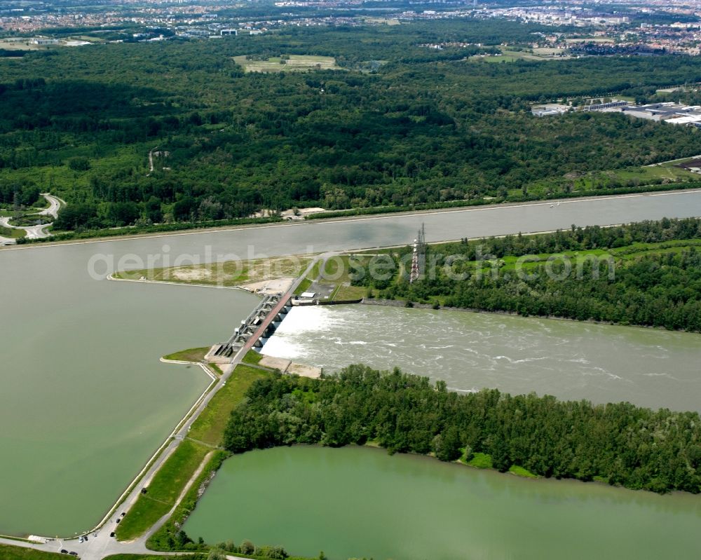 Kehl from above - The river Rhine at the city of Kehl in the state of Baden-Württemberg. In the overview visible is the run of the river through the landscape. The Rhine is the border to France in that area and is important for shipping and transportation and is surrounded by woods, small lakes and fields