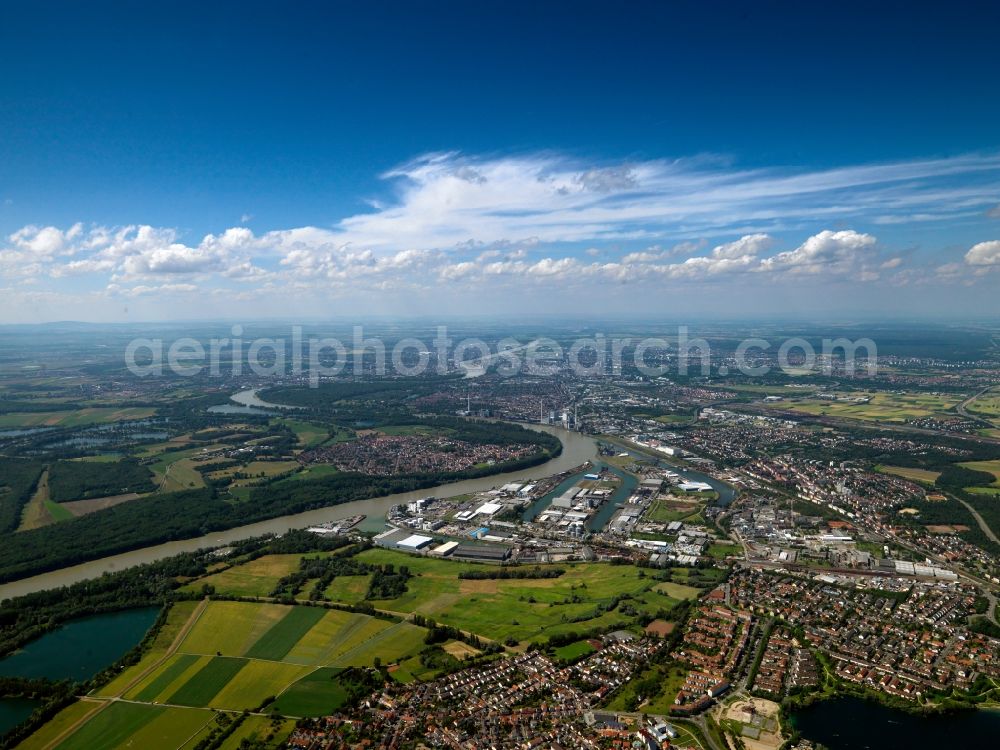 Mannheim from the bird's eye view: The river Rhine at the city of Mannheim in the state of Baden-Württemberg. In the overview visible is the run of the river through the landscape. In the background lies Mannheim. The Rhine is important for shipping and transportation and is surrounded by woods, small lakes and fields