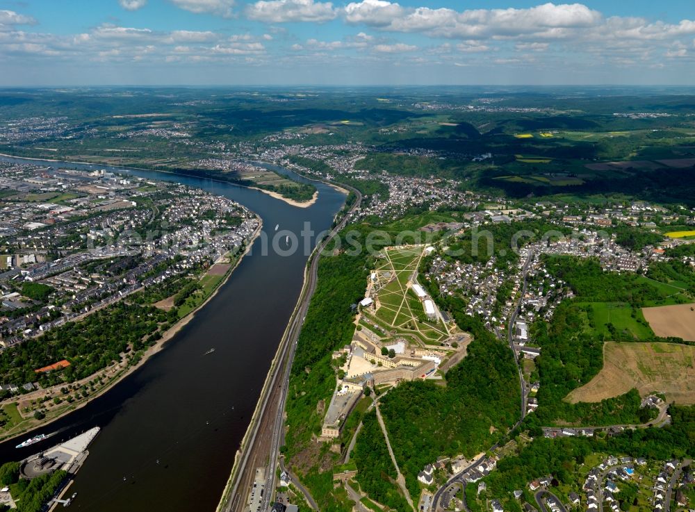 Koblenz from above - The river Rhine in Koblenz in the state of Rhineland-Palatinate. The metropolitan area of Koblenz is one of the oldest cities in Germany. Parts of Koblenz belong to the UNESCO world heritage. The river separates the city. Bridges, ships and small islands mark the run of the river in the area