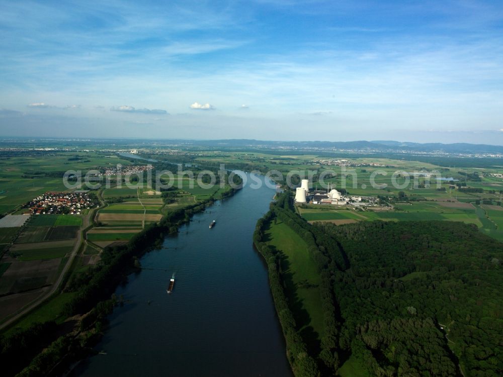 Biblis from above - The Rhine and the nuclear power plant Biblis in Biblis in the state of Hesse. Biblis is located in the Upper Rhine flatlands on the East riverbank. The nuclear power plant is located on the riverbank as well. It is owned by RWE Power AG and was turned off in 2011. The definitive giving up and deconstruction of the site was requested in 2012