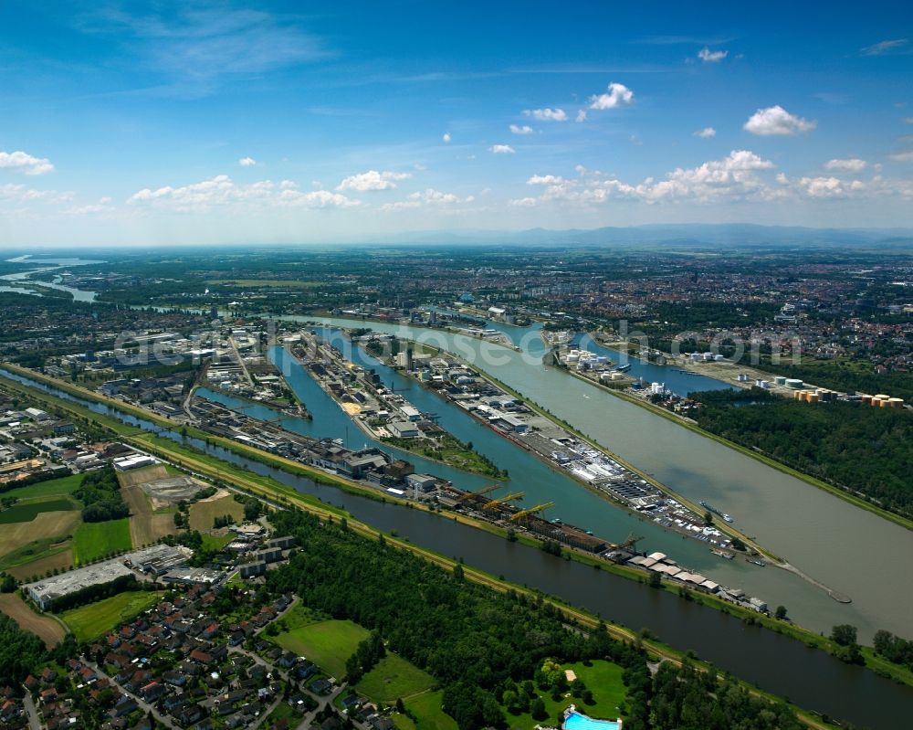 Kehl from above - The Rhine port in Kehl in the state of Baden-Württemberg. The port is located in the North of the city opposite the port of Strasbourg on the french side of the Rhine. It has been in place since 1842 and consists of 3 harbour pools and basins with a length of 12 km and a network of 42 km rail. The cargo handling is mainly on steel and iron goods