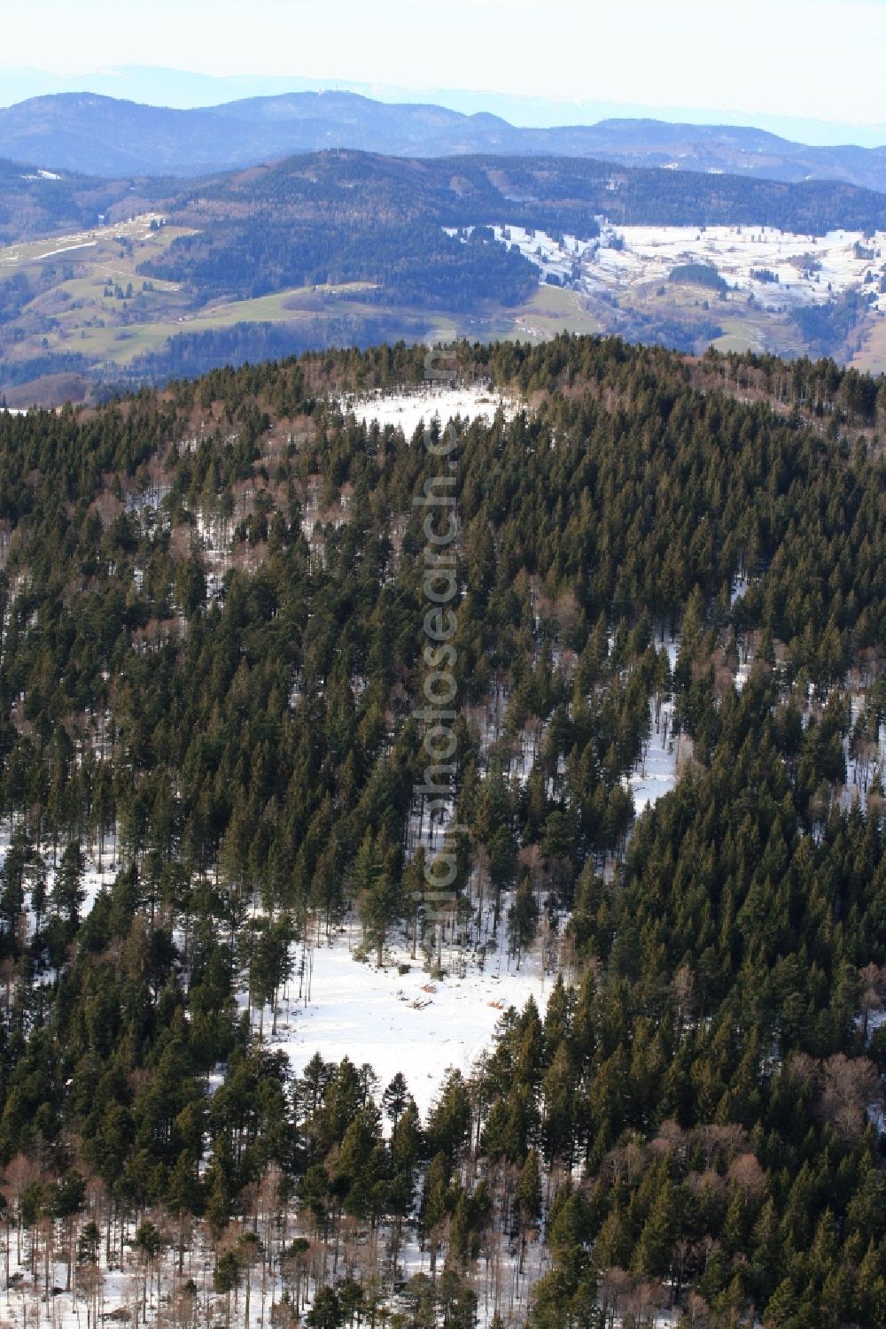 Aerial image Schopfheim - On the Rohrenkopf, the local mountain of Gersbach, a district of Schopfheim in Baden-Wuerttemberg, five wind turbines are planned to be built. The building areas for the wind turbines have already been cleared in the forest landscape