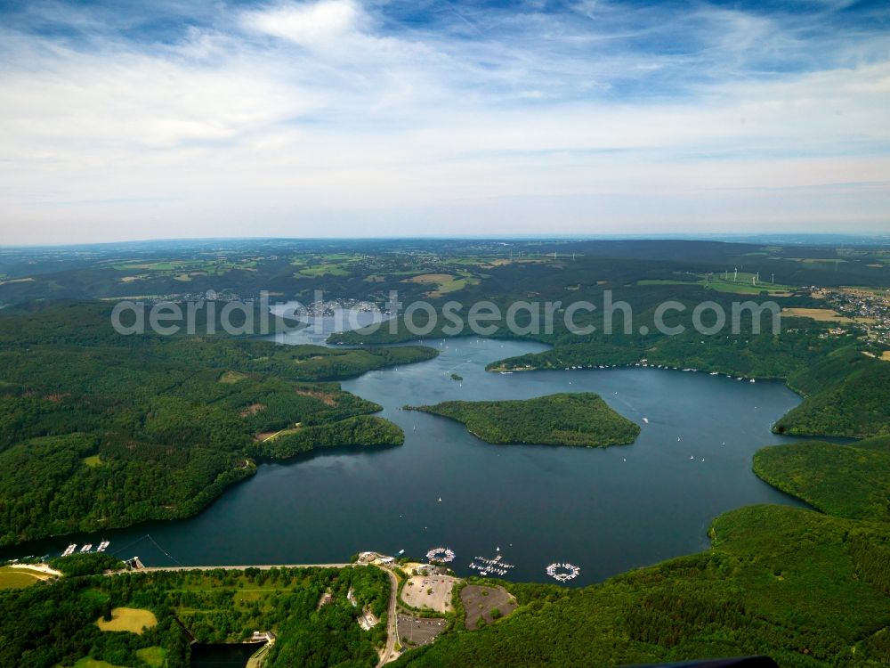 Aerial photograph Heimbach - The Rur barrier lake in the Hasenfelde part of the town of Heimbach in the state of North Rhine-Westphalia. The lake is created by the Rur valley dam Schwammenauel. In the lake there are two peninsulas as well as the island Eichert in the middle of that part of the lake. It is the second largest barrier lake in Germany and is used to regulate the river Rur, for power generation and as a recreational area