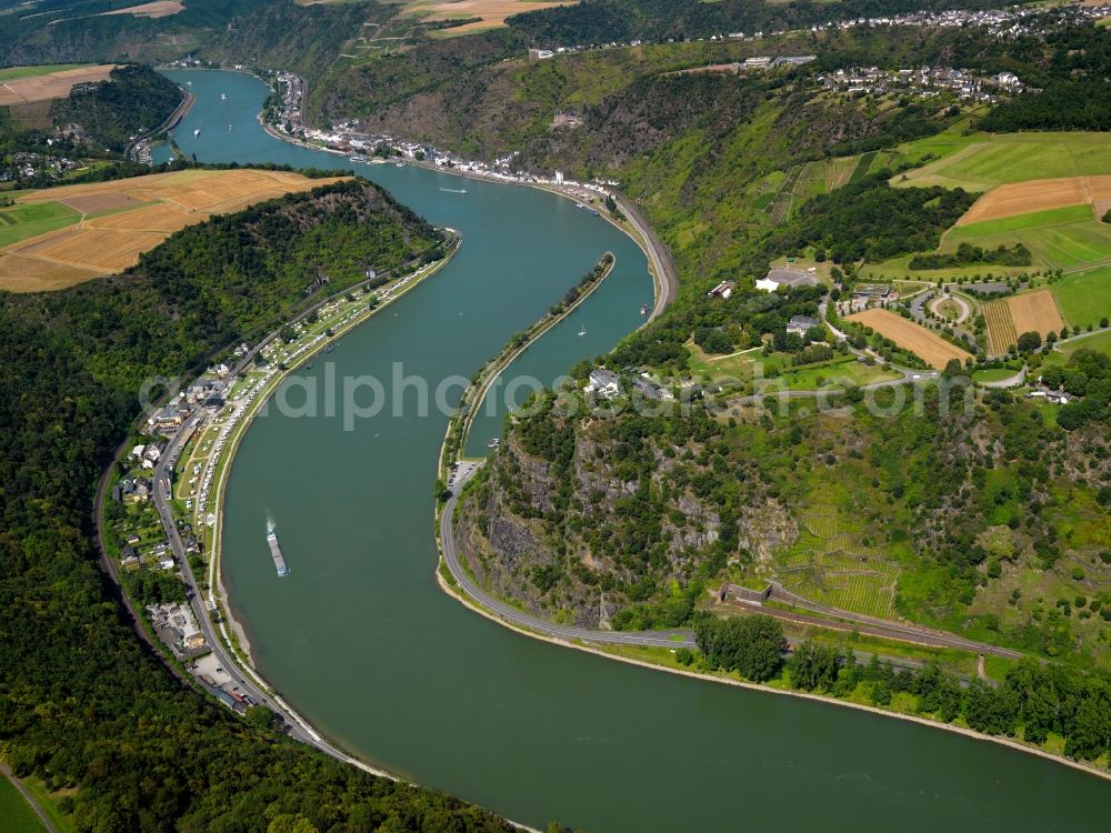 Aerial image Sankt Goarshausen - The shale rock Loreley on the Eastern Rhine shore in Sankt Goarshausen in the state of Rhineland-Palatinate. The rock causes a narrow passage of the river which runs in tight corners through the valley. Because of this, the region is renowned as being dangerous for shipping and boats and from time to time there are accidents. The rock itself is a beloved tourist and trip target