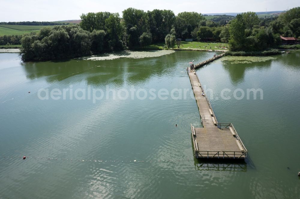 Seeburg from the bird's eye view: View of river banks and bridge with a lawn of Seeburger lake in Seeburg in Lower Saxony