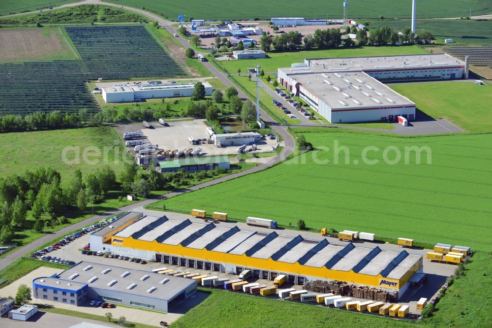 Lützen from above - The seat of the company Bauer&Mayer in the commercial park of Zorbau in Lützen in Saxony-Anhalt. View of the main hall of the logistics and transportation company. The commercial areal is next to the motorway A9