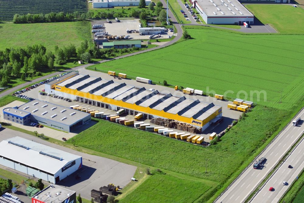 Lützen from the bird's eye view: The seat of the company Bauer&Mayer in the commercial park of Zorbau in Lützen in Saxony-Anhalt. View of the main hall of the logistics and transportation company. The commercial areal is next to the motorway A9