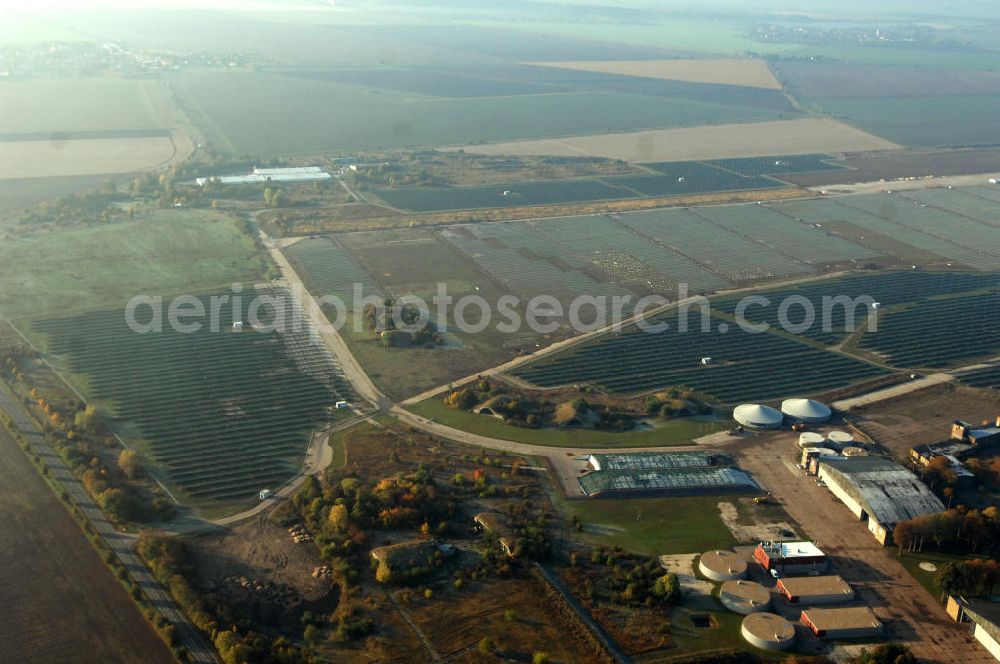 Aerial image Köthen - Blick auf den Solarpark. Auf einer Fläche von 55 Hektar ist es das bundesweit zweitgrößte Photovoltaik-Kraftwerk und wurde 2008 in Betrieb genommen. Die hochmoderne PV-Anlage besteht aus ca. 200.000 dünnschicht Solarmodulen der Firma First Solar. Betrieben wird das Feld von der juwi solar GmbH. Kontakt: juwi Holding AG, Energie-Allee 1, 55286 Wörrstadt, Tel. 06732 / 96 57- 0,