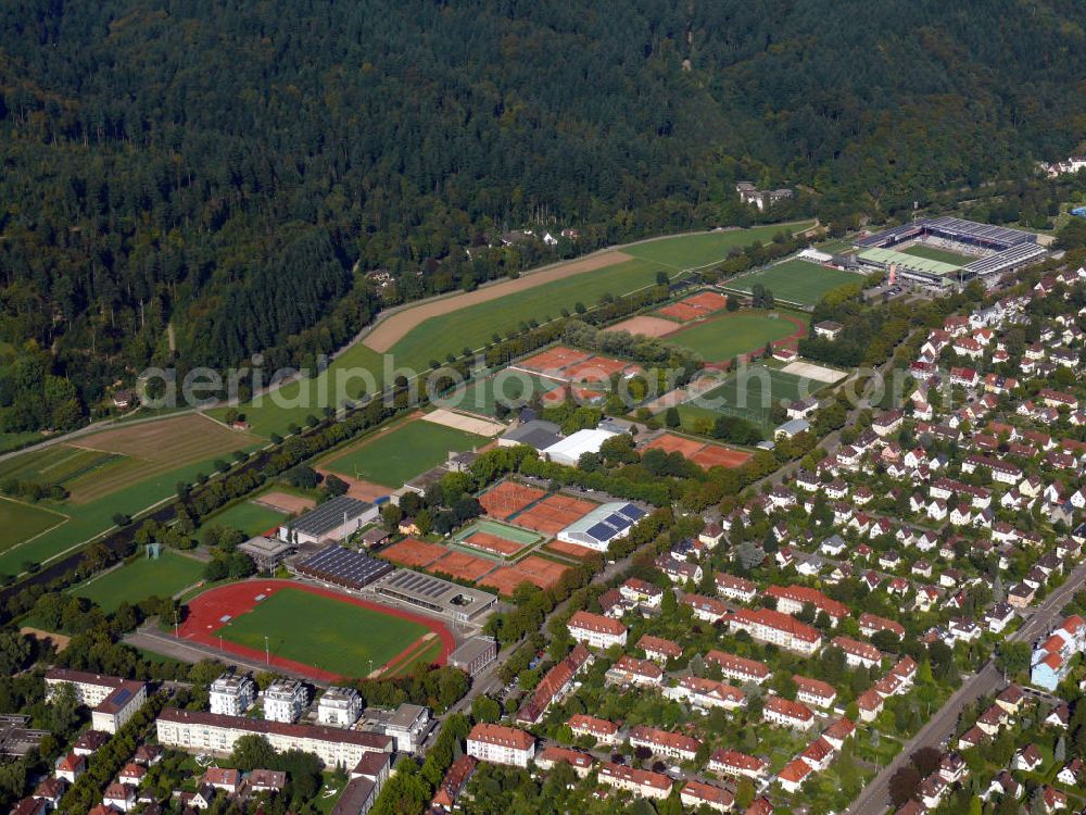 Aerial photograph Freiburg - Der FT - Sportpark vom Verein Freiburger Turnerschaft e.V. in direkter Nähe zum Fußballstadion vom FC Freiburg im östlichen Stadtteil Waldsee an der Schwarzwaldstraße in Freiburg, Baden-Württemberg. Auf dem Gelände befinden sich mehrere Hallen für Sportarten wie Judo, Tischtennis, Schwimmen und so weiter. Außerdem gibt es u.a. Tennisplätze, einen Rasen - bzw. Kunstrasenplatz, ein Hockeyfeld und eine Beachvolleyball-Anlage. The FT - sportspark of the club Freiburger Turnerschaft e.V. in close vicinity to the football stadium of the FC Freiburg in the eastern district Waldsee at the street Schwarzwaldstrasse in Freiburg, Baden-Wuerttemberg. Several halls for table tennis, judo, swimming, and so on are located on the ground. Furthermore, among others, tennis courts, a grass respectively an artificial grass pitch, a hockey pitch and a beach volleyball facility are available.