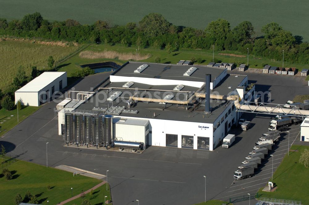 Aerial photograph Malchin - Blick auf die Produktionsstätte der ReFood GmbH. Die Gesellschaft ist europäischer Marktführer in der Verarbeitung und Verwertung tierischer Nebenprodukte und von Lebensmittelresten. Sie ist ein Tochterunternehmen der SARIA Bio-Industries AG & Co. KG. Kontakt: ReFood GmbH, Niederlassung Malchin, Gewerbegebiet An der Landwehr, 17139 Malchin, Tel. 03994 / 20 96-0,