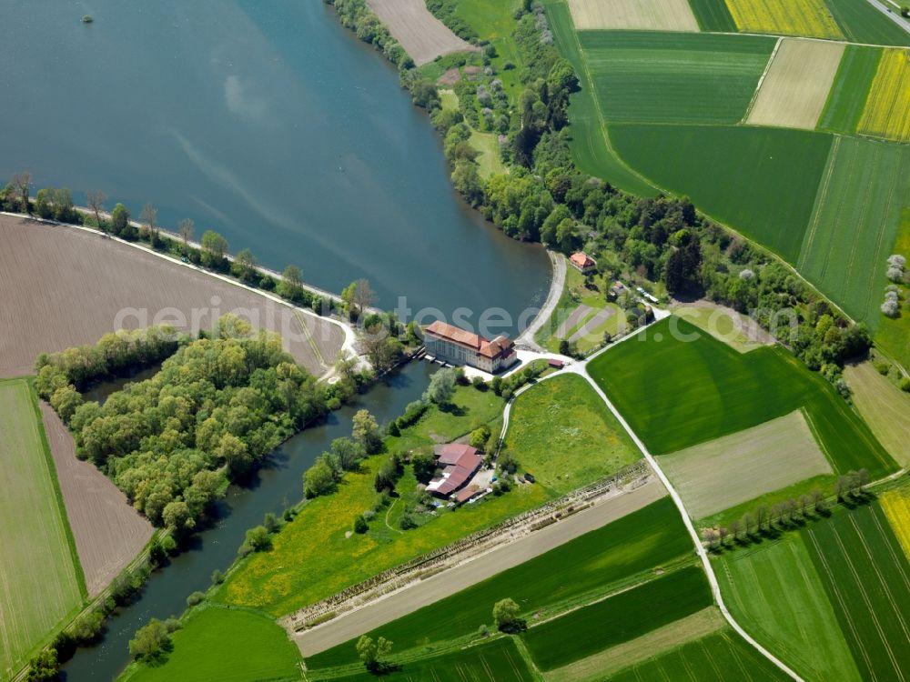 Öpfingen from above - The barrier lake and the power plant in Öpfingen in the state of Baden-Württemberg. The barrier lake is located on the Danube. The facilities consist of a channel, a lake and the plant which have been in place since the 1920s. It facilitates energy supply for the municipial utilities of Ulm and Neu-Ulm