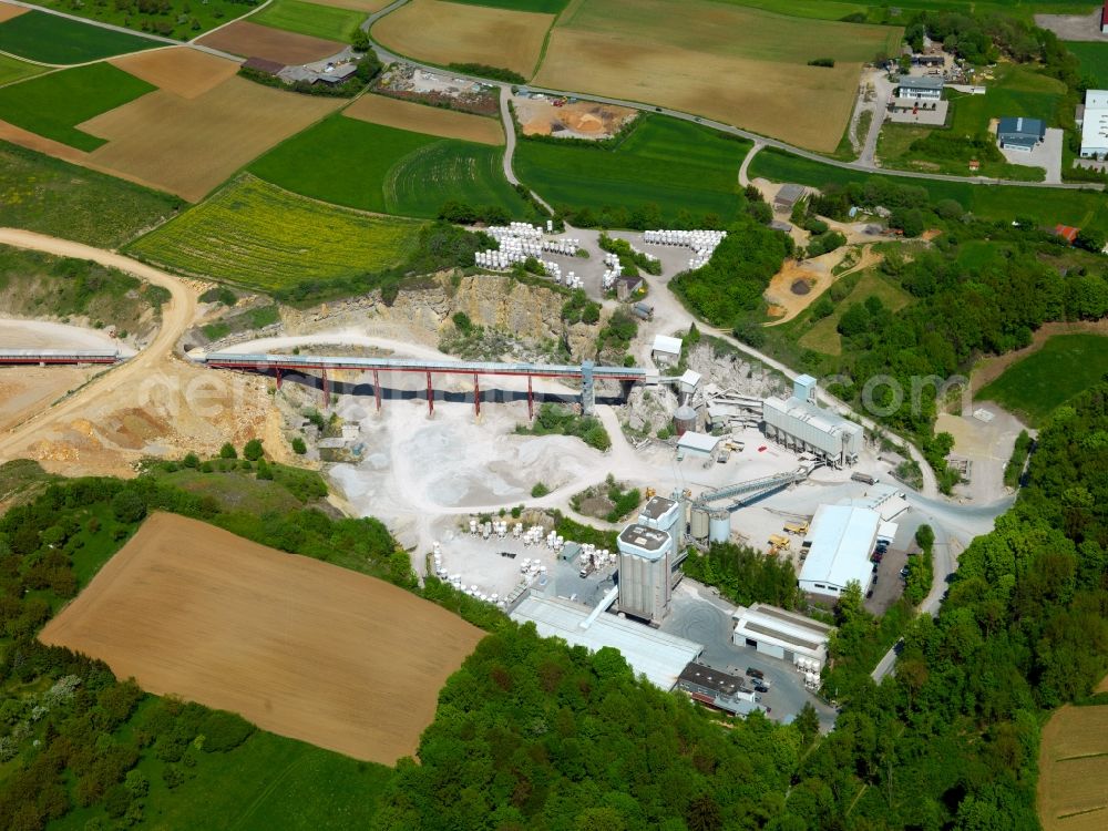 Aerial image Gräfenberg - The quarry and stone pit at Mountain Gräfenberg in the Spessart area of the state of Bavaria. The mountain is a sandstone outlier that is surrounded by lime. The lime is being mined today, the sandstone was mined until World War II