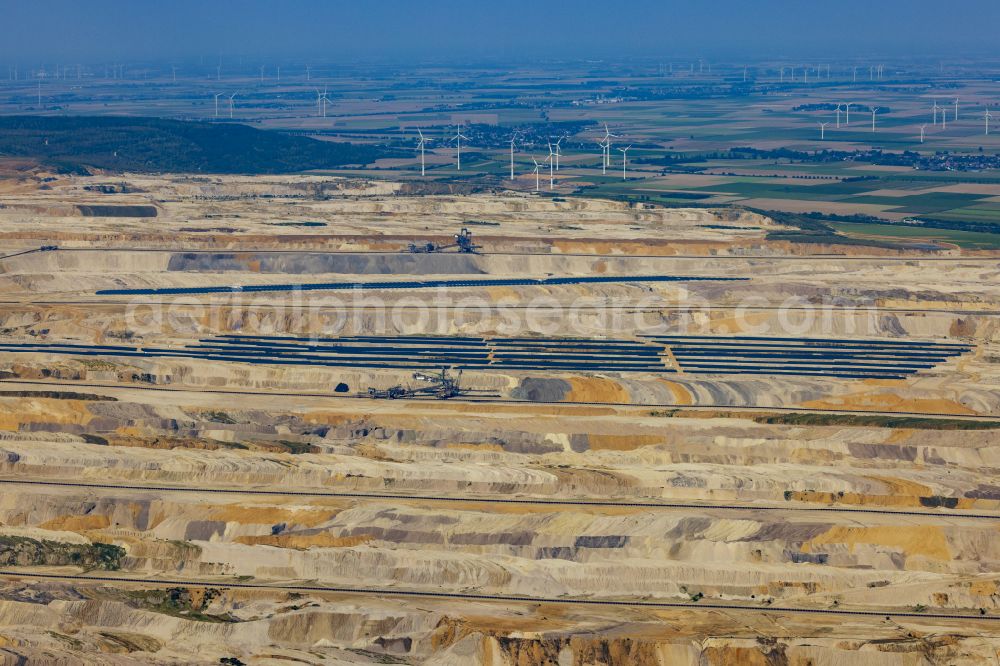 Aerial photograph Elsdorf - The Hambach opencast mine in Elsdorf in the Rhineland in the state of North Rhine-Westphalia. The mining area belongs to RWE Power AG. It is mainly brown coal that is mined. Solar power plants and photovoltaic systems are operated on the disused areas