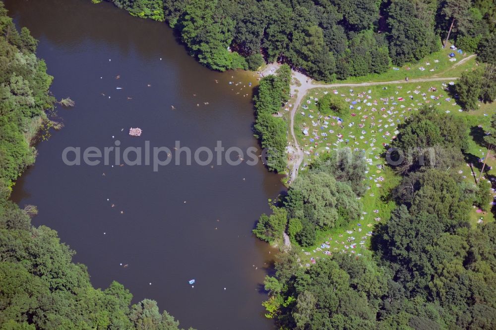 Berlin from above - The lake Teufelssee in the Grunewald forest area in the district of Charlottenburg - Wilmersdorf in Berlin in the state of Brandenburg. The lake is part of the nature reserve and wildlife sanctuary of Teufelsfenn, its south shore is a swimming area and holiday destination