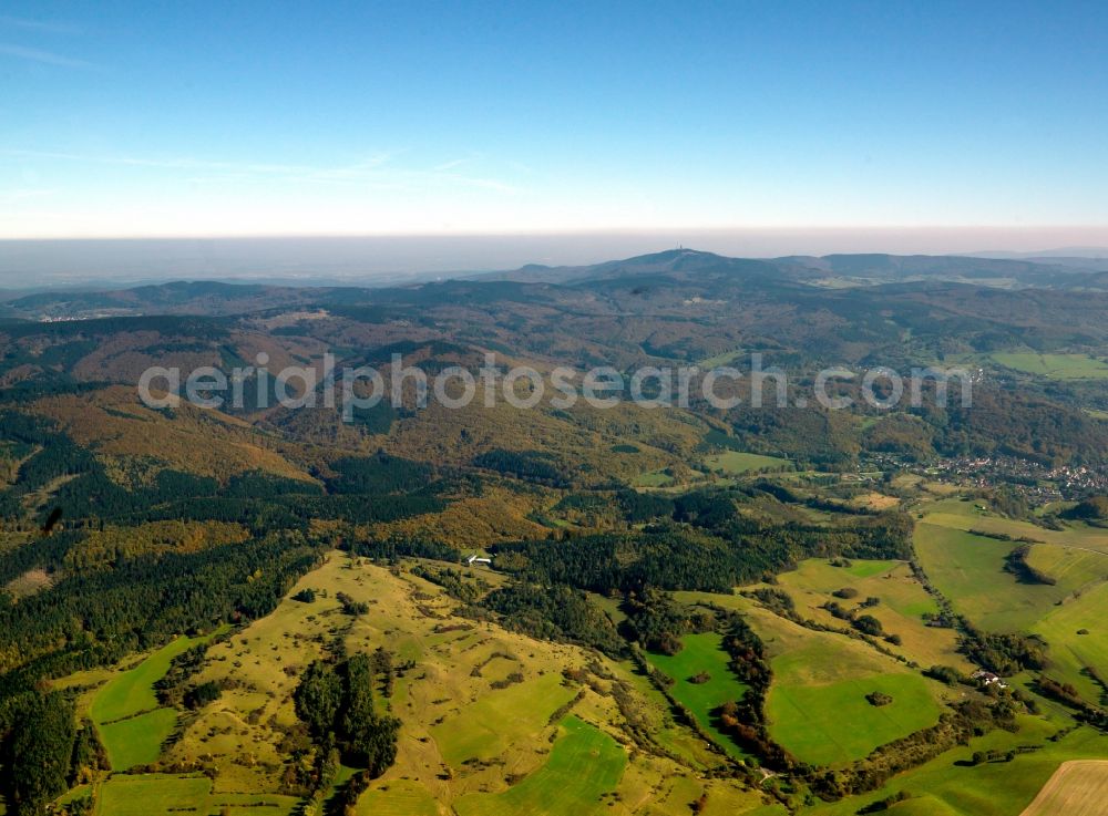 Bad Liebenstein from above - The Thuringian Forest in Bad Liebenstein in the state of Thuringia. Bad Liebenstein is the name giving part of the city of Bad Liebenstein in the Wartburg-Stiftung Eisenachkreis region. The city is important as a health resort and spa as well as a tourist destination. Visible in the overview are the hills and landscape of the region as well as its mixed tree forest