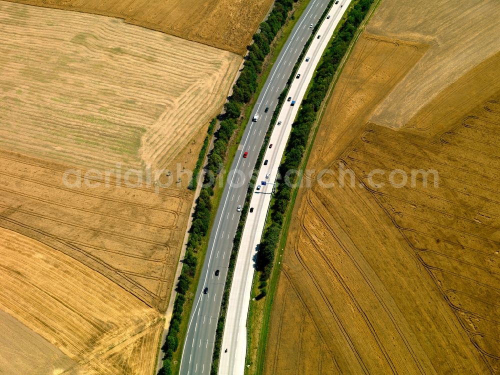 Aerial photograph Mendig - The run of the highway Autobahn A61 in the county of Mendig in the state of Rhineland-Palatinate. The Autobahn runs between fields in the landscape of the region. The A61 was the longest of the double digit Autobahnen in Germany and is the western most German Autobahn connection between the Netherlands, Belgium and Southern Germany