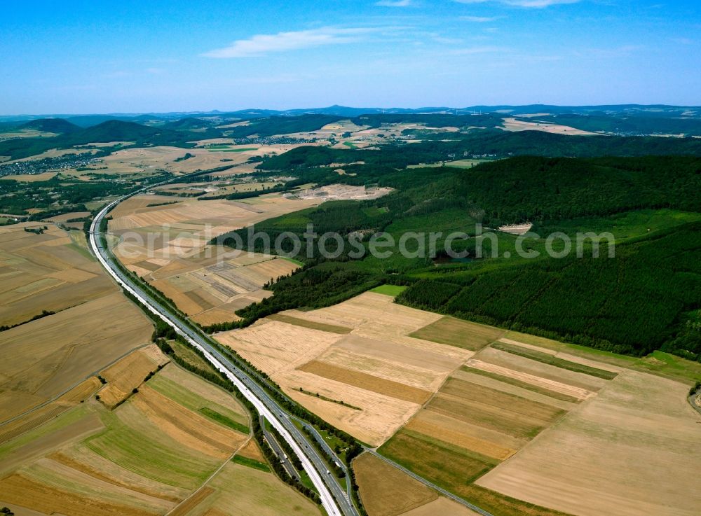 Mendig from the bird's eye view: The run of the highway Autobahn A61 in the county of Mendig in the state of Rhineland-Palatinate. The Autobahn runs between fields in the landscape of the region. The A61 was the longest of the double digit Autobahnen in Germany and is the western most German Autobahn connection between the Netherlands, Belgium and Southern Germany