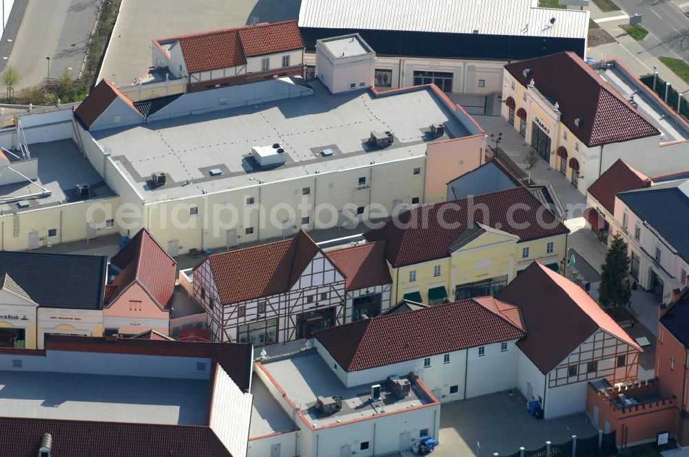 Aerial image Wustermark OT Elstal - Blick auf das Designer Outlet Berlin. Das im Stil eines Dorf errichtete Outlet, ist ein Projekt der Einwicklungs- und Betreibergesellschaft McArthurGlen gemeinsam mit Henderson Global Investors. View of the Berlin Designer Outlet in Elstal.