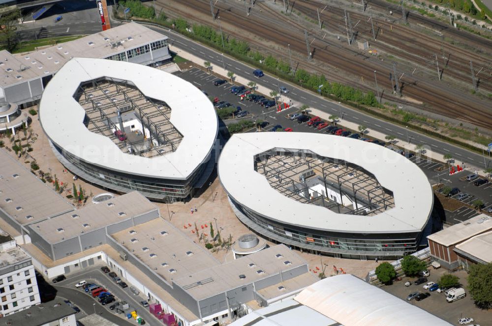 Aerial image Wolfsburg - Blick auf die Designer Outlets Center Wolfsburg in Niedersachsen. Am 15. Dezember 2007 öffnete das Shoppingcenter seine Pforten und bietet seit dem in 40 Läden hochwertige Designerstücke zu Rabattpreisen. Anfgeboten werden voriwegens Saisonware, sowie Auslaufmodelle. Die beiden imposanten, ellipsenförmigen Hauptgebäude unterstreichen das gute Image der Designermode. Architekt dieses Gebäudes ist Gerd Graf, Bauherr die Designer Outlets OCI Wolfsburg Gmbh. Kontakt Center: designer outlets Wolfsburg, An der Vorburg 1, 38440 Wolfsburg, Tel. +49(0)5361 89350 0, Fax +49(0)5361 89350 30, Email: wolfsburg@designeroutlets.com; Kontakt Architekt: Gerd und Werner Graf Architekten, Wilhelm-Mangels-Straße 21, 56410 Montabaur, Tel. +49(0)2602 1306 0, Fax +49(0)2602 1306 21