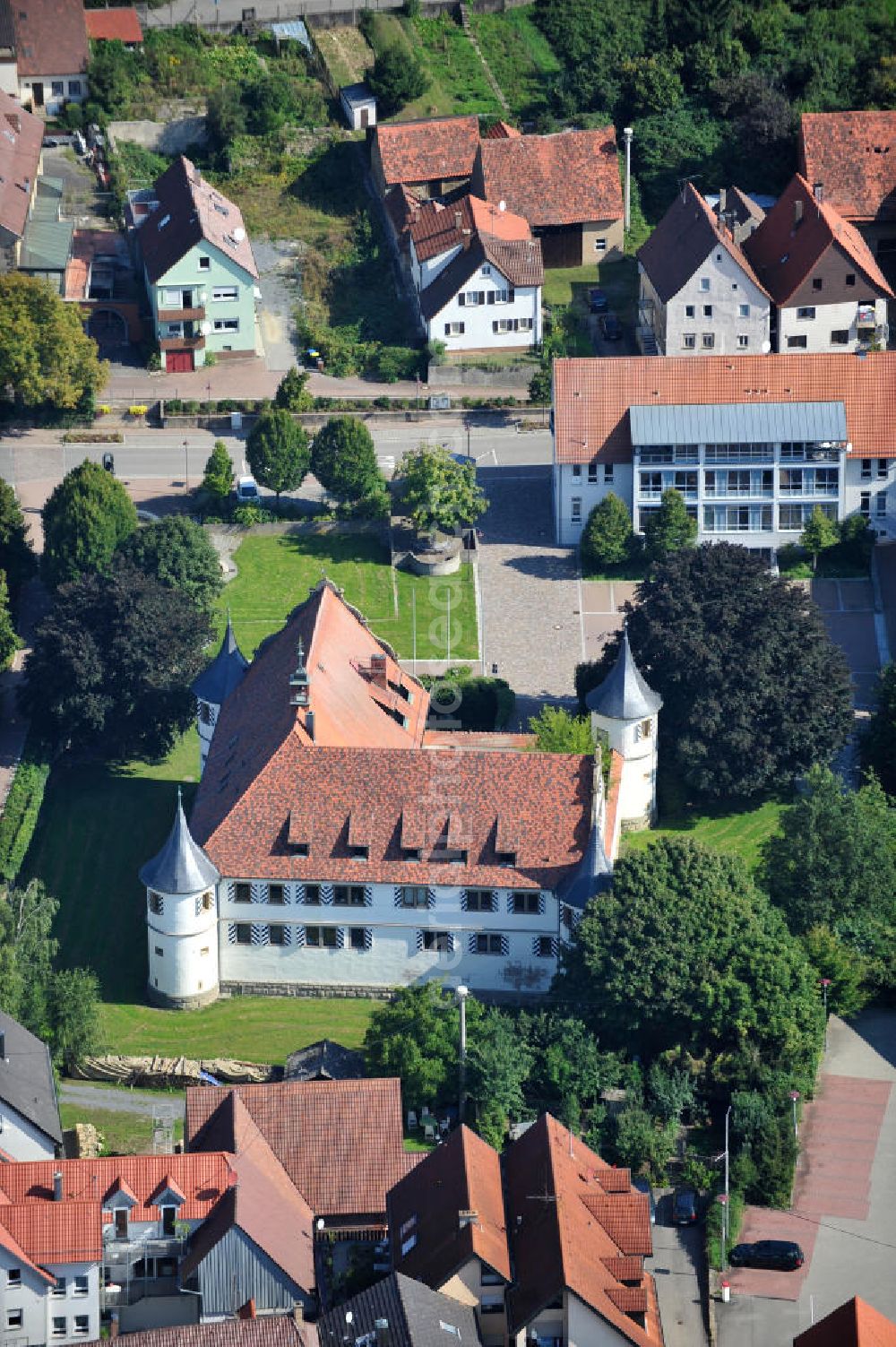 Aerial image KIRCHHAUSEN - HEILBRONN - Das Deutschordensschloss in Kirchhausen, einem Stadtteil von Heilbronn im nördlichen Baden-Württemberg, ist ein ehemaliges Wasserschloss des Deutschen Ordens, das in den Jahren 1572 bis 1576 im Stil der Renaissance erbaut wurde. The German Order Castle in Kirchhausen, a district of Heilbronn in northern Baden-Württemberg, is a former water castle of the Teutonic Order, which was built in the years 1572 to 1576 in the style of the Renaissance.