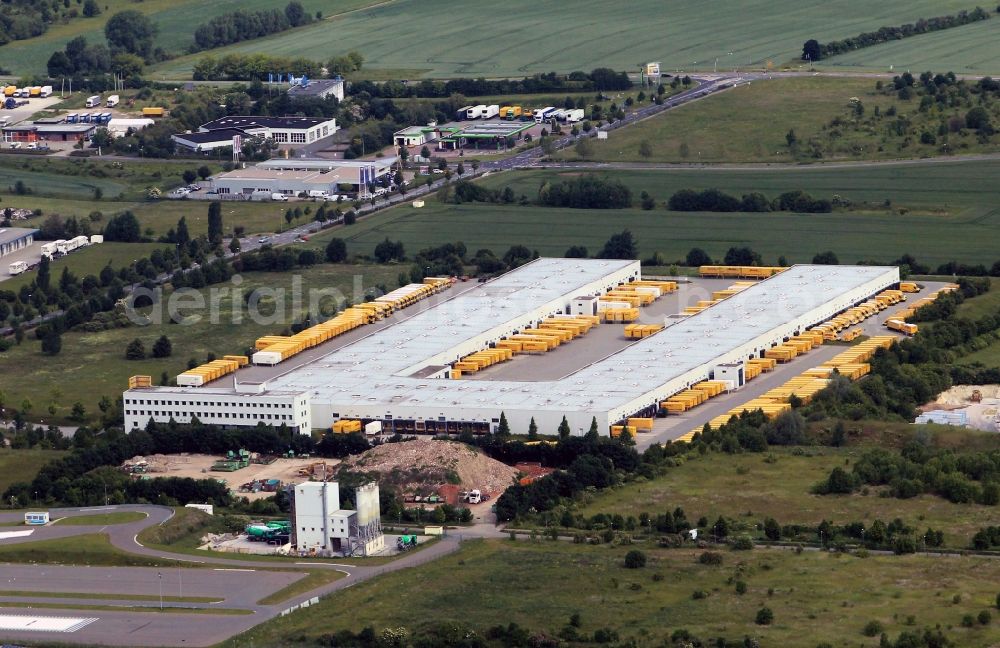 Aerial photograph Nohra - The DHL cargo center Nohra Erfurt in Thuringia is located in a commercial area in the Stangestrasse. From this logistics center for parcel delivery the northern rural and urban districts of Thuringia are supplied. The plant is equipped with the most modern distribution and loading. Hundreds DHL trucks are stocked here with mailings