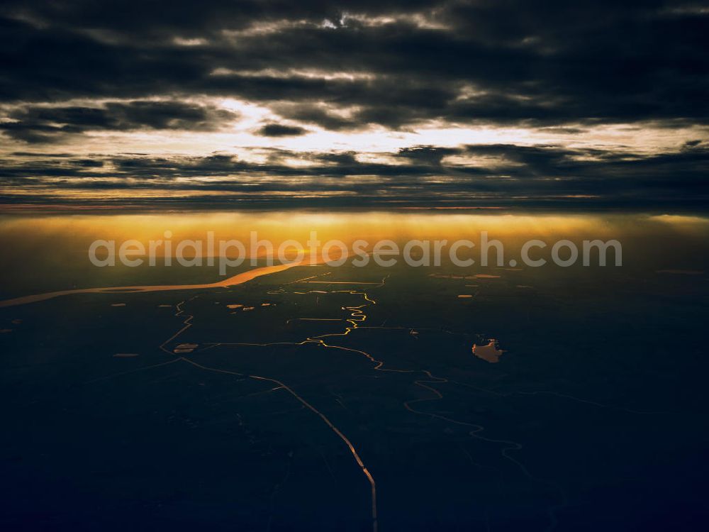 Leer from the bird's eye view: View of the View of the Dollart bay in the Weser-Ems county, through which the Ems river flows into the North Sea. The water is illuminated by the evening sun