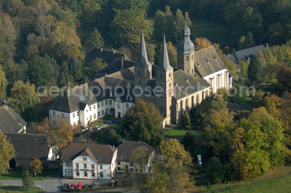 Marienmünster from the bird's eye view: Blick auf die Abtei Marienmünster. Das ehemalige Benediktinerkloster liegt in Nordrhein-Westfahlen. Erbaut wurde es 1127 bis 1128 durch Graf Widekind I. von Schwalenberg. Im Jahr 1803 wurde das Kloster aufgelöst, doch seit 1965 leben dort die Passionisten. Während des 30jährigen Krieges wurde das Kloster weitgehend zerstört, doch im Jahr 1661 wieder Aufgebaut, mehrere Umbauten führten dazu, dass das Gebäude sowohl romanische, barocke als auch gotische Elemente besitzt. Seit 2006 sorgt eine Stiftung dafür, dass das Gebäude aufwendig restauriert wird. Kontakt: Stadt Marienmünster, Schulstraße 1, 37696 Marienmünster, Tel. 05276/9898-0, info@marienmuenster.de