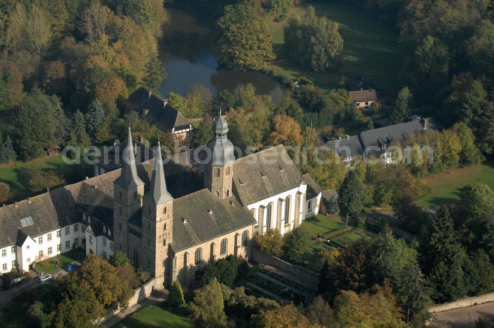 Aerial image Marienmünster - Blick auf die Abtei Marienmünster. Das ehemalige Benediktinerkloster liegt in Nordrhein-Westfahlen. Erbaut wurde es 1127 bis 1128 durch Graf Widekind I. von Schwalenberg. Im Jahr 1803 wurde das Kloster aufgelöst, doch seit 1965 leben dort die Passionisten. Während des 30jährigen Krieges wurde das Kloster weitgehend zerstört, doch im Jahr 1661 wieder Aufgebaut, mehrere Umbauten führten dazu, dass das Gebäude sowohl romanische, barocke als auch gotische Elemente besitzt. Seit 2006 sorgt eine Stiftung dafür, dass das Gebäude aufwendig restauriert wird. Kontakt: Stadt Marienmünster, Schulstraße 1, 37696 Marienmünster, Tel. 05276/9898-0, info@marienmuenster.de