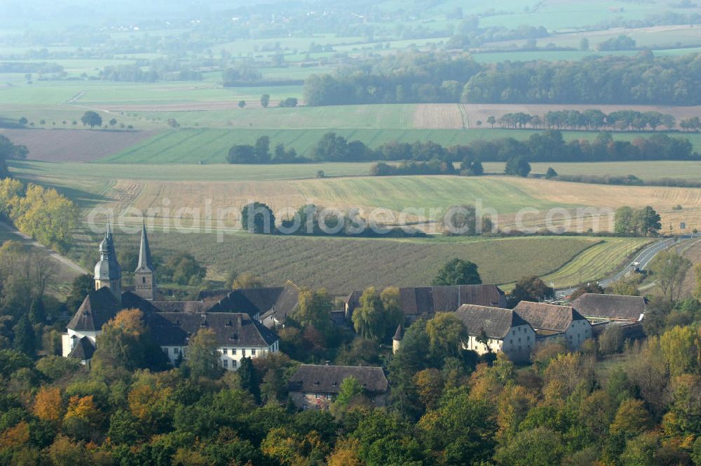 Marienmünster from the bird's eye view: Blick auf die Abtei Marienmünster. Das ehemalige Benediktinerkloster liegt in Nordrhein-Westfahlen. Erbaut wurde es 1127 bis 1128 durch Graf Widekind I. von Schwalenberg. Im Jahr 1803 wurde das Kloster aufgelöst, doch seit 1965 leben dort die Passionisten. Während des 30jährigen Krieges wurde das Kloster weitgehend zerstört, doch im Jahr 1661 wieder Aufgebaut, mehrere Umbauten führten dazu, dass das Gebäude sowohl romanische, barocke als auch gotische Elemente besitzt. Seit 2006 sorgt eine Stiftung dafür, dass das Gebäude aufwendig restauriert wird. Kontakt: Stadt Marienmünster, Schulstraße 1, 37696 Marienmünster, Tel. 05276/9898-0, info@marienmuenster.de