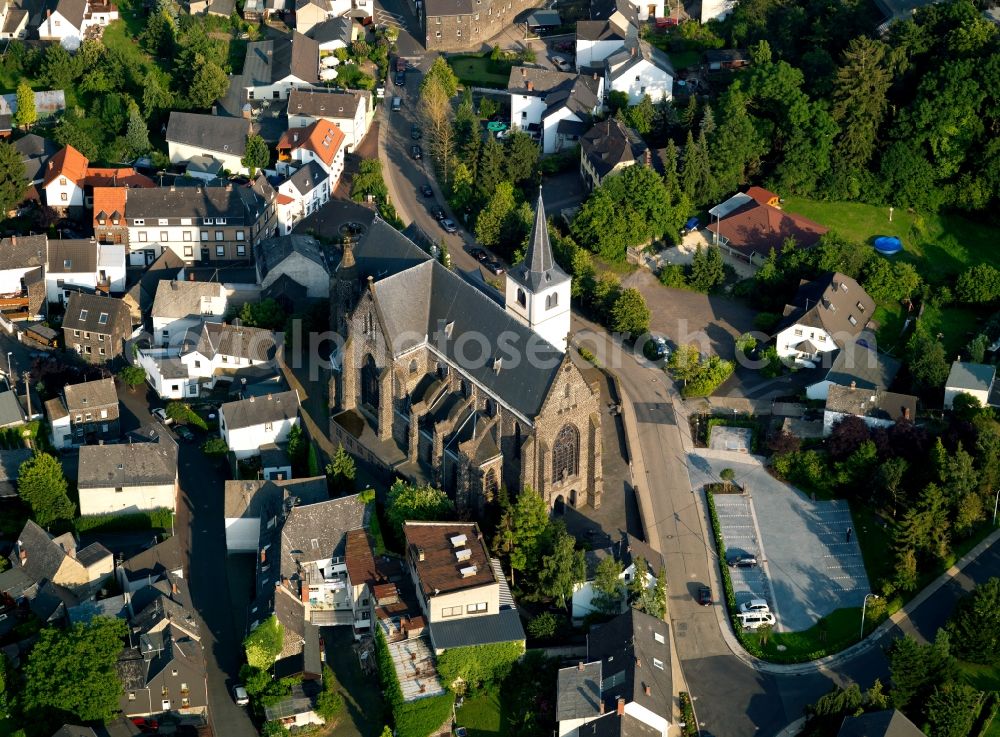 Aerial image Niedermendig - The old parish church of St. Cyriac in Niedermendig is a Romanesque church from the 12th Century. In the middle of the 19th Century, was built onto the old church a new church to St.. Cyriac and St. Barbara was ordained. When renovating the old church from 1886 to 1888 medieval wall paintings were discovered, which are exposed from 1897 again