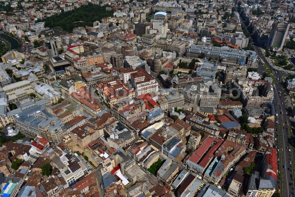 Bukarest from the bird's eye view: The Old Town of Bucharest and the buildings of the Romanian National Bank in the romanian capital of Bucharest. The overview shows the Old Town, also called District Lipscani, in Sector 3. Central in the image are the buildings of the National Bank. The old building is facing South, was completed in 1890 and is a listed and protected monument. The larger new building is facing North with its facade located on Strada Doamnei. It was built during World War II