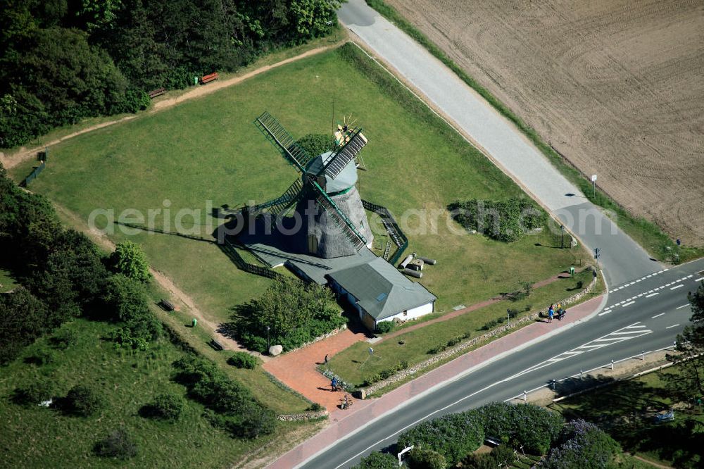 Nebel auf Amrum from above - The windmill Amrum is located in the North Sea island Amrum. It stands on the highest natural elevation in the city and is considered as a landmark of the island. The mill is a listed building and houses a museum