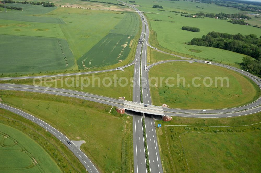 Aerial photograph Stralsund - Blick auf die Autobahn Anschlussstelle Stralsund 24. Sie verbindet die A 20 mit der B 96, als Zubringer zur Insel Rügen. Eröffnet wurde sie im November 2004. Kontakt: DEGES Deutsche Einheit Fernstraßenplanungs- und -bau GmbH Öffentlichkeitsarbeit, Tel. 030-202 43 352, info@deges.de