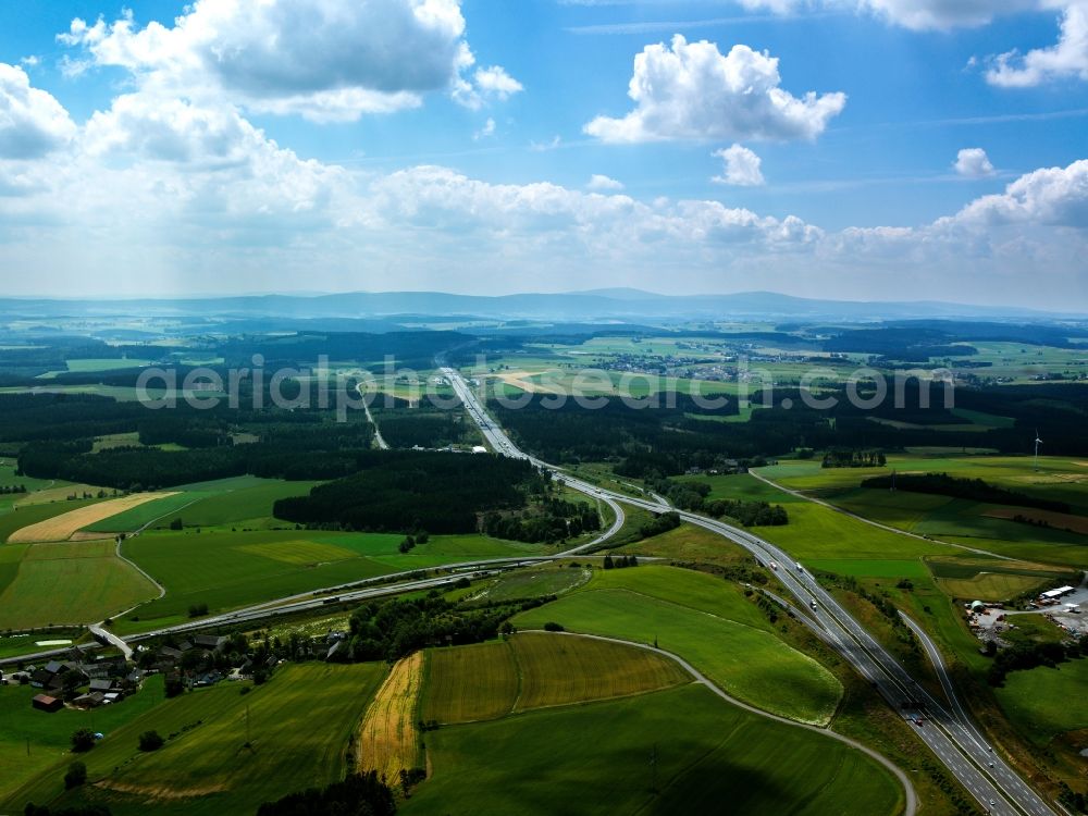 Leupoldsgrün from the bird's eye view: The federal motorway (Autobahn) A9 and its surrounding landscape in the area of Leupoldsgruen in the state of Bavaria. The motorway runs through Upper Franconia, past the town of Hof in North South direction. It passes hills, fields and forest and connects Munich and Berlin