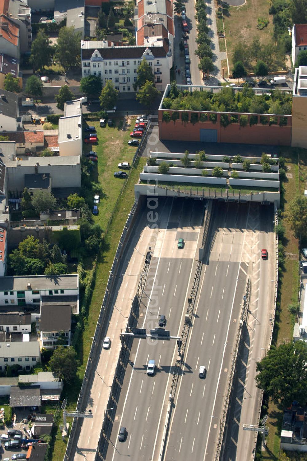 Aerial photograph Berlin - Blick auf ie Autobahnauffahrt 24 Buschkrugallee der A100, die Berliner Stadtautobahn.