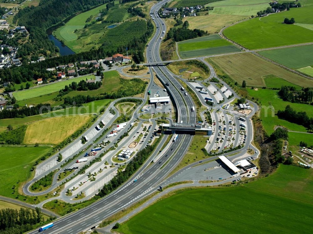 Aerial image Berg - The motorway service areas Frankenwald East and West and the bridge restaurant in the Rudolphstein part of the borough of Berg in the state of Bavaria. The restaurant was opened in 1967 as the first of its kind in Germany. It crosses the federal motorway A9 which connects Berlin and Munich via Leipzig and Nuremberg. The service areas are located on Exit 30