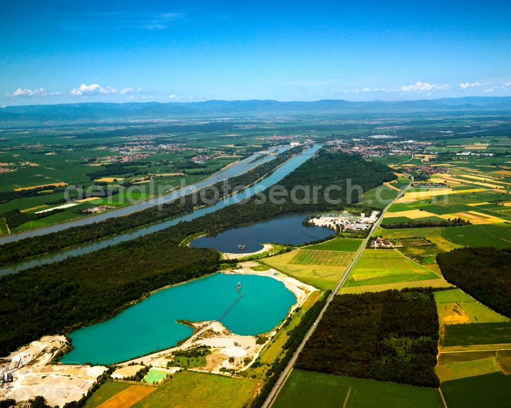 Breisach from above - The artificial lakes in the Oberrimsingen part of Breisach in the state of Baden-Württemberg. The three lakes are located at the shores of the river Rhine. Originally used as gravel pits by the inhabitants of Oberrimsingen and Niederrimsingen, the Rimsinger Lake is a favoured tourist site and leisure area today. It is also famous as a nude beach