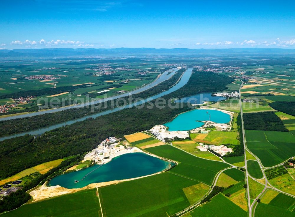 Aerial image Breisach - The artificial lakes in the Oberrimsingen part of Breisach in the state of Baden-Württemberg. The three lakes are located at the shores of the river Rhine. Originally used as gravel pits by the inhabitants of Oberrimsingen and Niederrimsingen, the Rimsinger Lake is a favoured tourist site and leisure area today. It is also famous as a nude beach