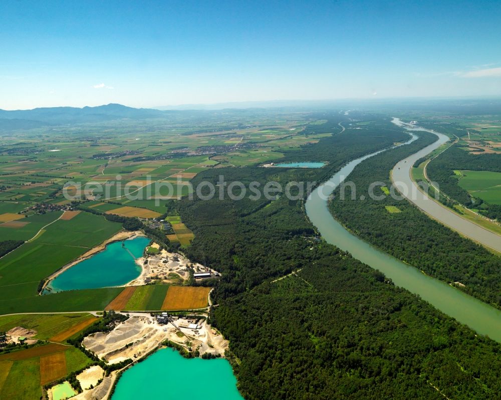 Breisach from above - The artificial lakes in the Oberrimsingen part of Breisach in the state of Baden-Württemberg. The three lakes are located at the shores of the river Rhine. Originally used as gravel pits by the inhabitants of Oberrimsingen and Niederrimsingen, the Rimsinger Lake is a favoured tourist site and leisure area today. It is also famous as a nude beach