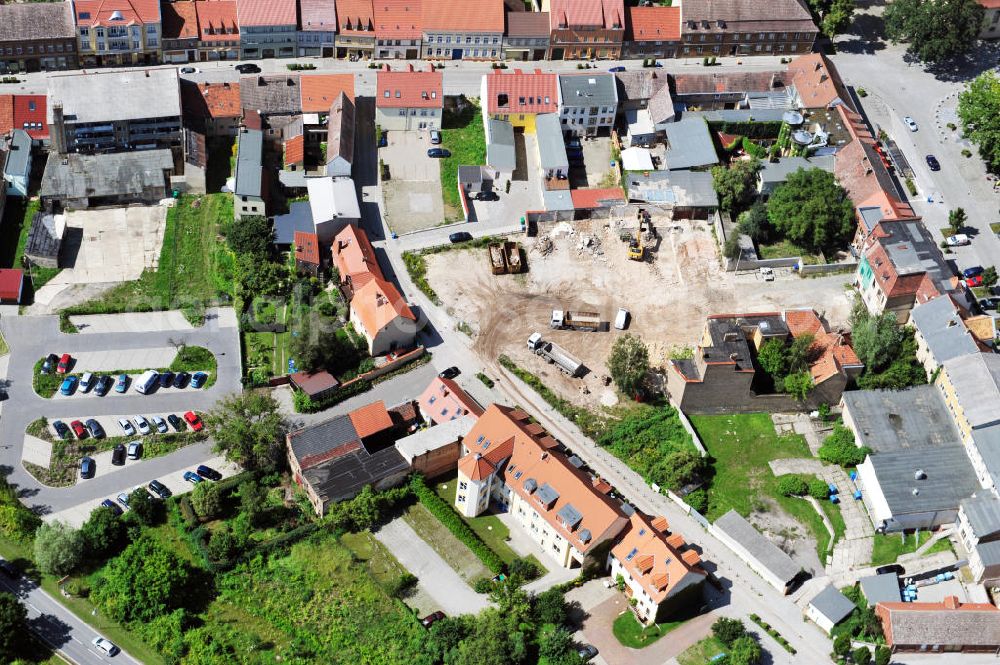 Zossen from above - View of the construction site of the excavation at the street market in Zossen in Brandenburg. On the ground of the old post office is a new building of the former telephone exchange being built