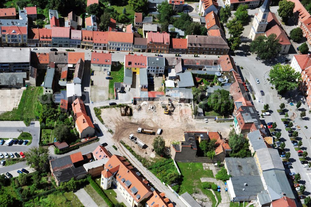 Zossen from the bird's eye view: View of the construction site of the excavation at the street market in Zossen in Brandenburg. On the ground of the old post office is a new building of the former telephone exchange being built