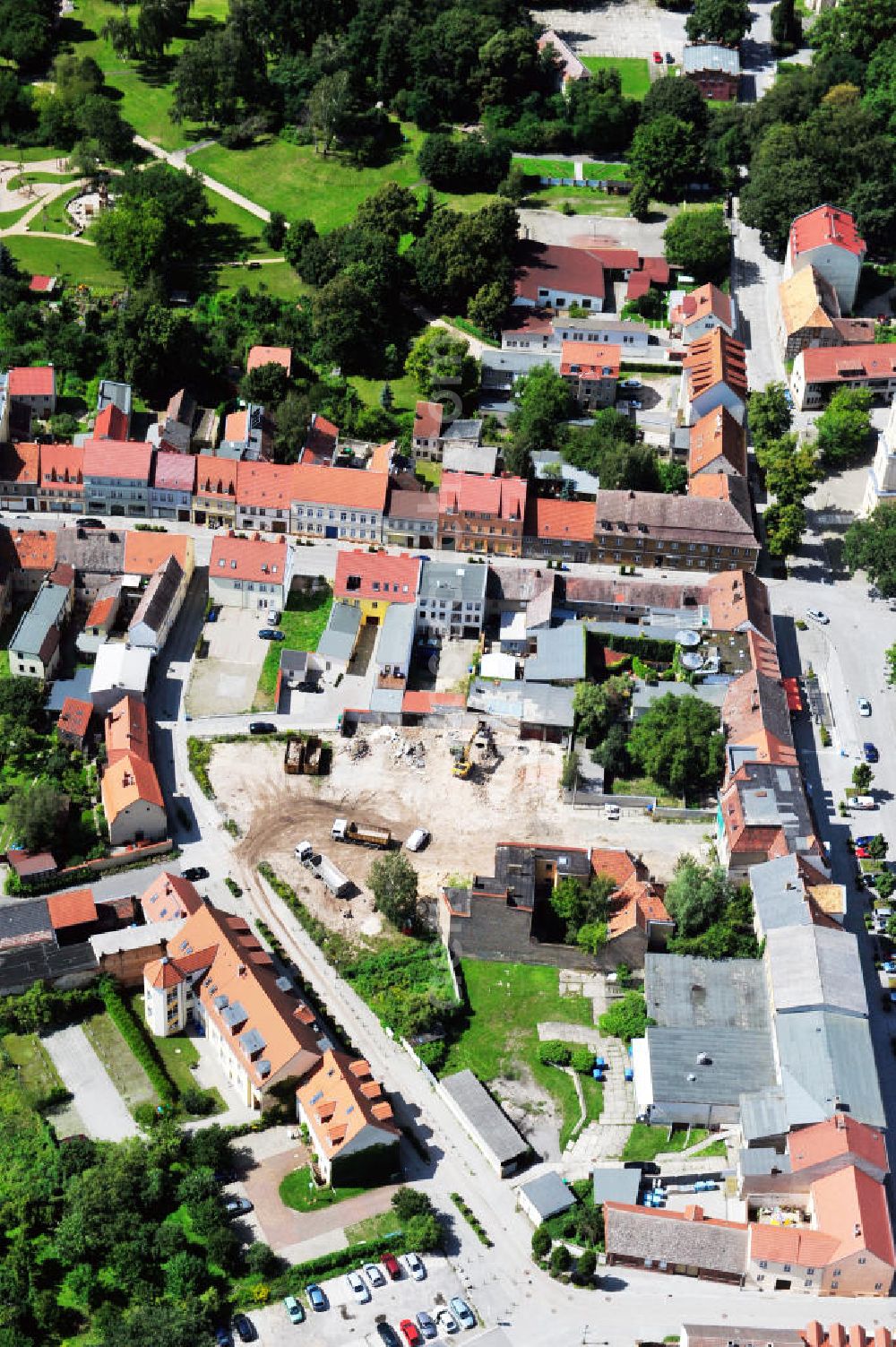 Aerial image Zossen - View of the construction site of the excavation at the street market in Zossen in Brandenburg. On the ground of the old post office is a new building of the former telephone exchange being built